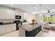 Modern kitchen with granite island and stainless steel appliances at 1820 Holden Ridge Ln, Clermont, FL 34715