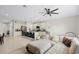 Open living room with sectional sofa and kitchen views at 1820 Holden Ridge Ln, Clermont, FL 34715