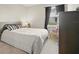 Bright bedroom with a queen bed and neutral decor at 1820 Holden Ridge Ln, Clermont, FL 34715