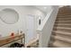 Inviting entryway with staircase, storage, and mirror at 1820 Holden Ridge Ln, Clermont, FL 34715