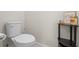 Powder room with toilet and small shelf at 1820 Holden Ridge Ln, Clermont, FL 34715