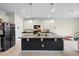 Modern kitchen with granite island and ample cabinetry at 1820 Holden Ridge Ln, Clermont, FL 34715