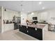 Modern kitchen with granite countertops and large island at 1820 Holden Ridge Ln, Clermont, FL 34715