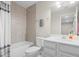 Clean bathroom with a tub, shower, and white vanity at 1820 Holden Ridge Ln, Clermont, FL 34715
