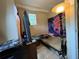 Small bedroom with a full-size bed and floor lamp at 1117 E Hubbard Ave, Deland, FL 32724