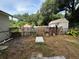 Backyard with shed and wooden fence at 1117 E Hubbard Ave, Deland, FL 32724
