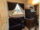 Bedroom with large TV and dresser at 1117 E Hubbard Ave, Deland, FL 32724