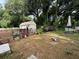 Backyard with shed and wooden fence at 1117 E Hubbard Ave, Deland, FL 32724