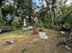 Large backyard with mature trees and a shed at 1117 E Hubbard Ave, Deland, FL 32724
