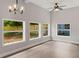 Sunlit dining area with hardwood floors and multiple windows at 1321 Cloverlawn Ave, Orlando, FL 32806