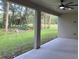Covered patio with ceiling fan and view of the backyard at 1420 Lake Harney Rd, Geneva, FL 32732