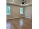 Spacious bedroom with wood flooring and two large windows at 1420 Lake Harney Rd, Geneva, FL 32732