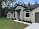 Modern home exterior with stone accents and landscaping at 1420 Lake Harney Rd, Geneva, FL 32732