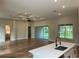 Open living space with hardwood floors, high ceilings and sliding glass doors at 1420 Lake Harney Rd, Geneva, FL 32732