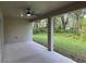 Covered patio with ceiling fan, overlooking the backyard at 1420 Lake Harney Rd, Geneva, FL 32732