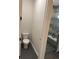 Modern bathroom with toilet, shower, and grey tile floor at 1420 Lake Harney Rd, Geneva, FL 32732