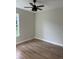 Spacious bedroom featuring wood-look flooring and a ceiling fan at 1420 Lake Harney Rd, Geneva, FL 32732