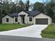 Two-story house with stone accents and a two-car garage at 1420 Lake Harney Rd, Geneva, FL 32732