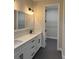 Double vanity bathroom with a large mirror and walk-in closet at 1420 Lake Harney Rd, Geneva, FL 32732