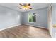Simple bedroom with wood-look flooring and a ceiling fan at 108 Clear Lake Cir, Sanford, FL 32773