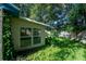 Backyard view of shed and lush greenery at 108 Clear Lake Cir, Sanford, FL 32773