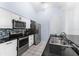Updated kitchen featuring stainless steel appliances and granite countertops at 108 Clear Lake Cir, Sanford, FL 32773
