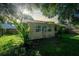 Landscaped backyard with a shed and mature trees at 108 Clear Lake Cir, Sanford, FL 32773