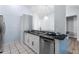 Modern kitchen with stainless steel appliances and a breakfast bar at 108 Clear Lake Cir, Sanford, FL 32773