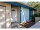 House entrance with light blue accents, white door and tiled entryway at 108 Clear Lake Cir, Sanford, FL 32773