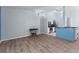 Open dining area with wood-look floors and kitchen view at 108 Clear Lake Cir, Sanford, FL 32773