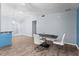 Simple dining area with glass-top table and white chairs at 108 Clear Lake Cir, Sanford, FL 32773
