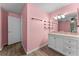 Bathroom with a vanity, mirror, and wood-look flooring at 108 Clear Lake Cir, Sanford, FL 32773