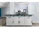 Modern kitchen with white cabinets, granite countertops and blue tile backsplash at 108 Clear Lake Cir, Sanford, FL 32773