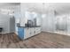 Modern kitchen with island, white cabinets, and granite countertops at 108 Clear Lake Cir, Sanford, FL 32773