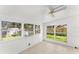 Spacious sunroom featuring multiple windows and a ceiling fan at 108 Clear Lake Cir, Sanford, FL 32773