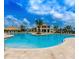 Resort-style pool with a clubhouse and palm trees at 4804 Romeo Cir, Kissimmee, FL 34746