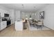 Open concept kitchen and dining area with modern finishes and breakfast bar at 7883 Sw 138Th Street Rd, Ocala, FL 34473
