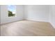 Bright bedroom with large window and light wood flooring at 7883 Sw 138Th Street Rd, Ocala, FL 34473