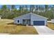 New construction home with gray exterior and blue garage door at 7883 Sw 138Th Street Rd, Ocala, FL 34473