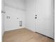 Laundry room with wire shelving and a door at 7883 Sw 138Th Street Rd, Ocala, FL 34473