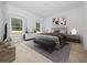 Bright bedroom with wood-look floors and large windows at 7883 Sw 138Th Street Rd, Ocala, FL 34473