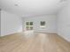 Spacious living room with sliding glass doors leading to backyard at 7883 Sw 138Th Street Rd, Ocala, FL 34473