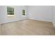 Spacious bedroom with light walls and wood-look floors at 7883 Sw 138Th Street Rd, Ocala, FL 34473