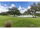 Peaceful community landscape with a lake and lush greenery at 14229 Sunridge Blvd, Winter Garden, FL 34787