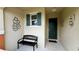 Inviting entryway with a bench and decorative wall art at 3167 Tocoa Cir, Kissimmee, FL 34746