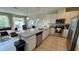 Open concept kitchen with island and stainless steel appliances at 3167 Tocoa Cir, Kissimmee, FL 34746