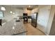 Modern kitchen with stainless steel appliances and granite counters at 3167 Tocoa Cir, Kissimmee, FL 34746
