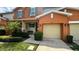 Front view of townhouse, showcasing garage and landscaping at 3167 Tocoa Cir, Kissimmee, FL 34746