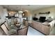 Open concept dining area with glass table and kitchen views at 3167 Tocoa Cir, Kissimmee, FL 34746