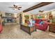 Spacious living room featuring a stone fireplace and a large window at 132 N Hastings St, Orlando, FL 32835